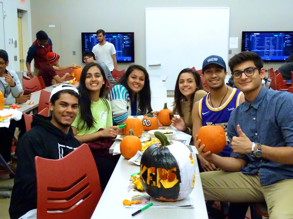 Students carving pumpkins